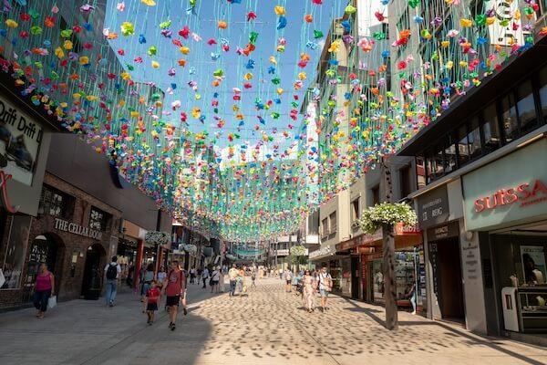 Shopping in Andorra - image by MartinSCPhoto/Shutterstock.com
