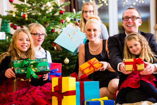 German family exchanging gifts on Christmas