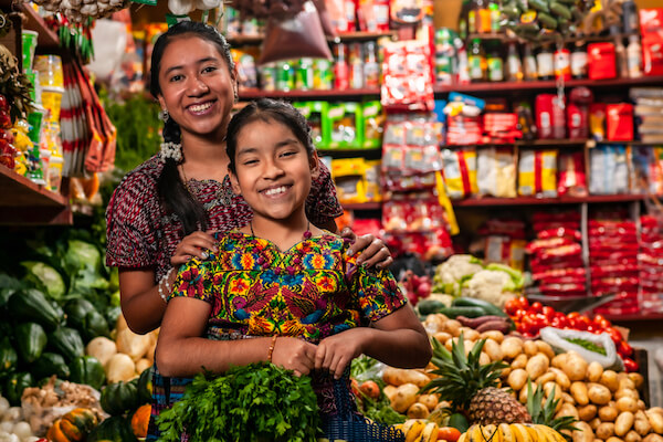 Two smiling Guatemalan women in shop