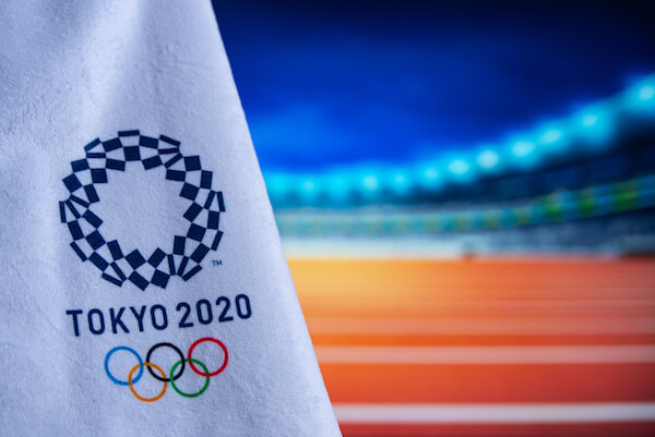 Tokyo Olympics Flag with logo - image by Krovop58/shutterstock.com