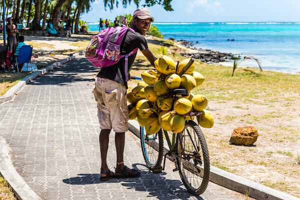 Mauritius Coconut Vendor at the Beach - image by Bivalent/shutterstock.com
