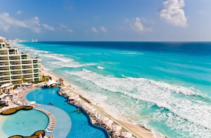 Mexico Cancun beach with turquoise sea and hotel