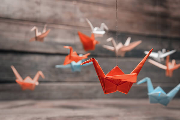 Pink and red origami paper cranes