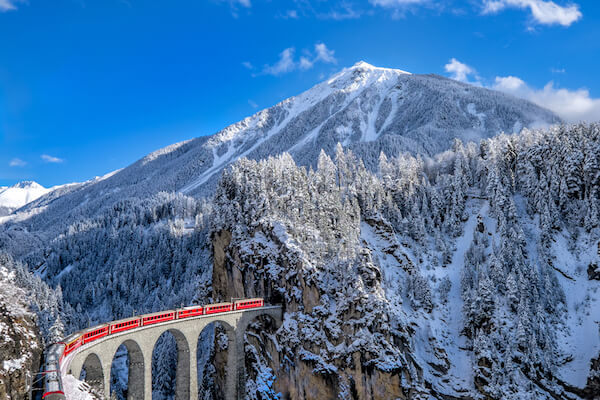 Switzerland Glacier Express in winter with blue sky
