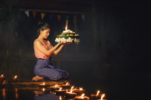 Girl at Loi Krathong festival with flower float