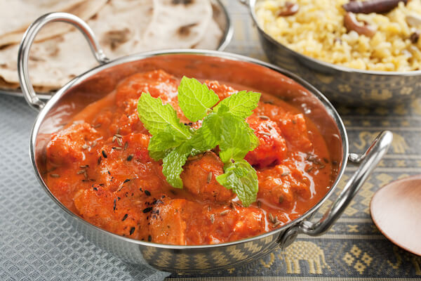 Chicken Tikka in balti dish with roti and rice