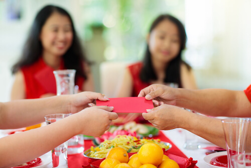 Gifting red packets on Chinese New Year