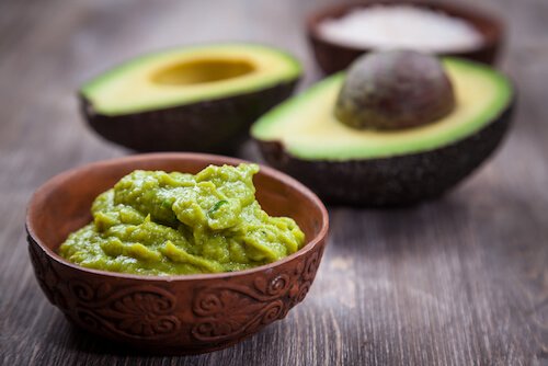 avocado and guacamole in a dish