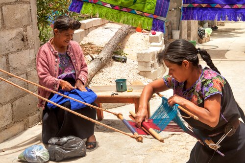 Mayan Women weaving_ image by Lena Wurm/shutterstock.com