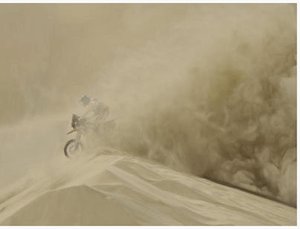 Dakar rally motobiker in sandstorm -image by dpa