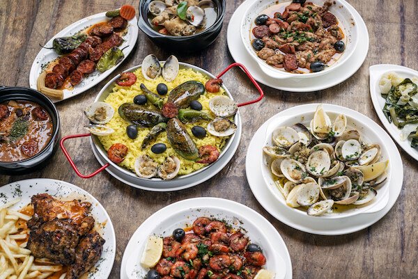 Typical Portuguese dishes on wooden table